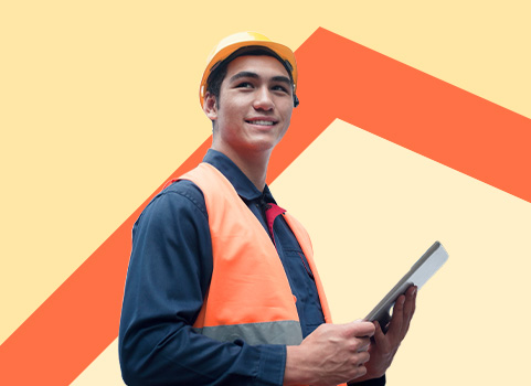 Person in protective gear with tablet on orange background.