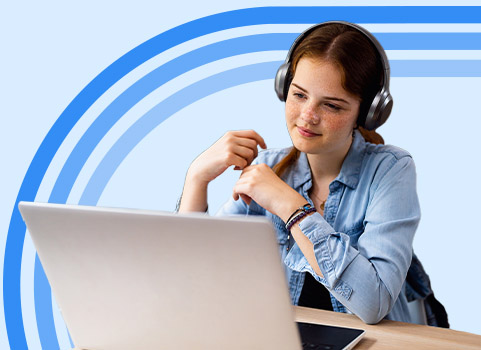 High school student wearing headphones while watching a lesson on their laptop.