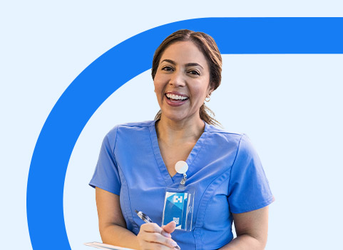 Woman in blue scrubs taking notes.