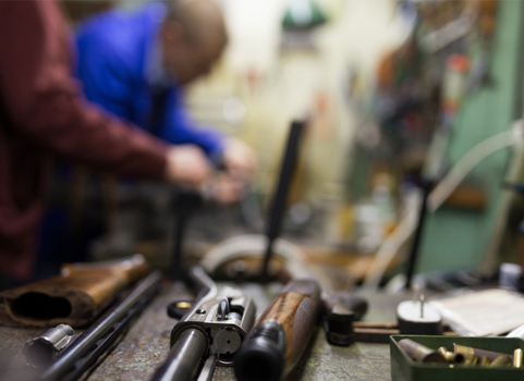 A close up image of a gun in pieces 